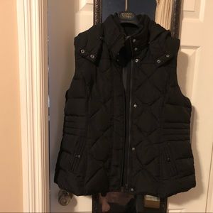 Ricki’s black vest